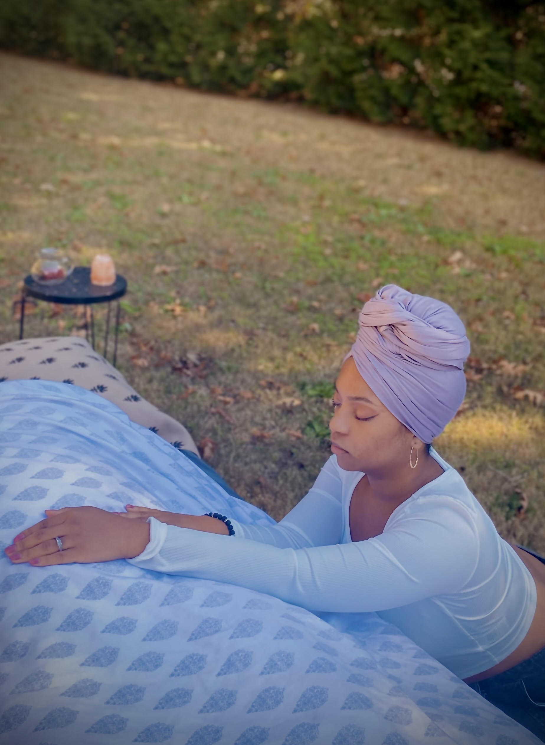 Aulana Smith practicing energy healing outdoors